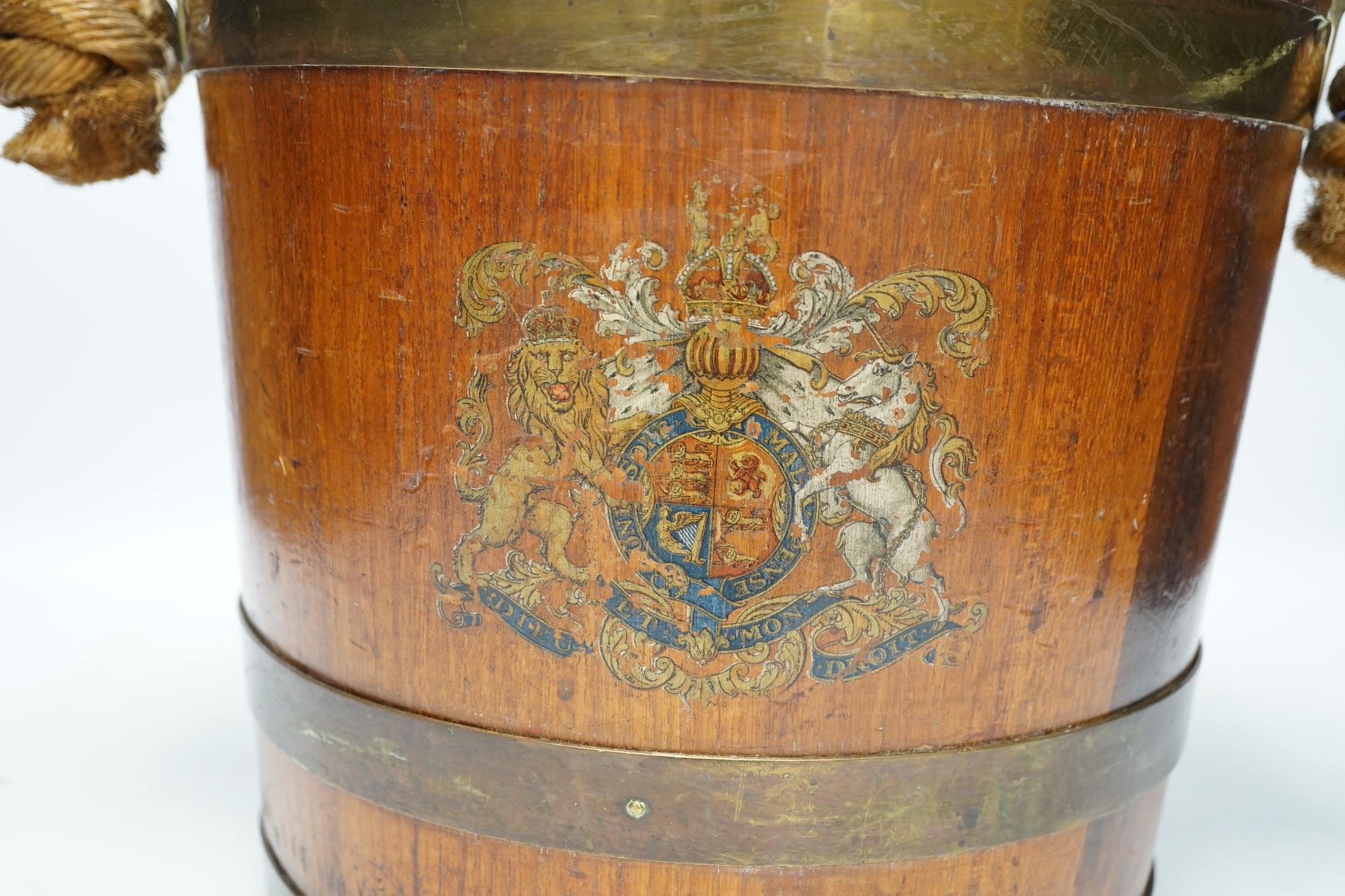 A 19th century naval brass bound painted teak bucket with rope handle, 31cm. Condition - fair